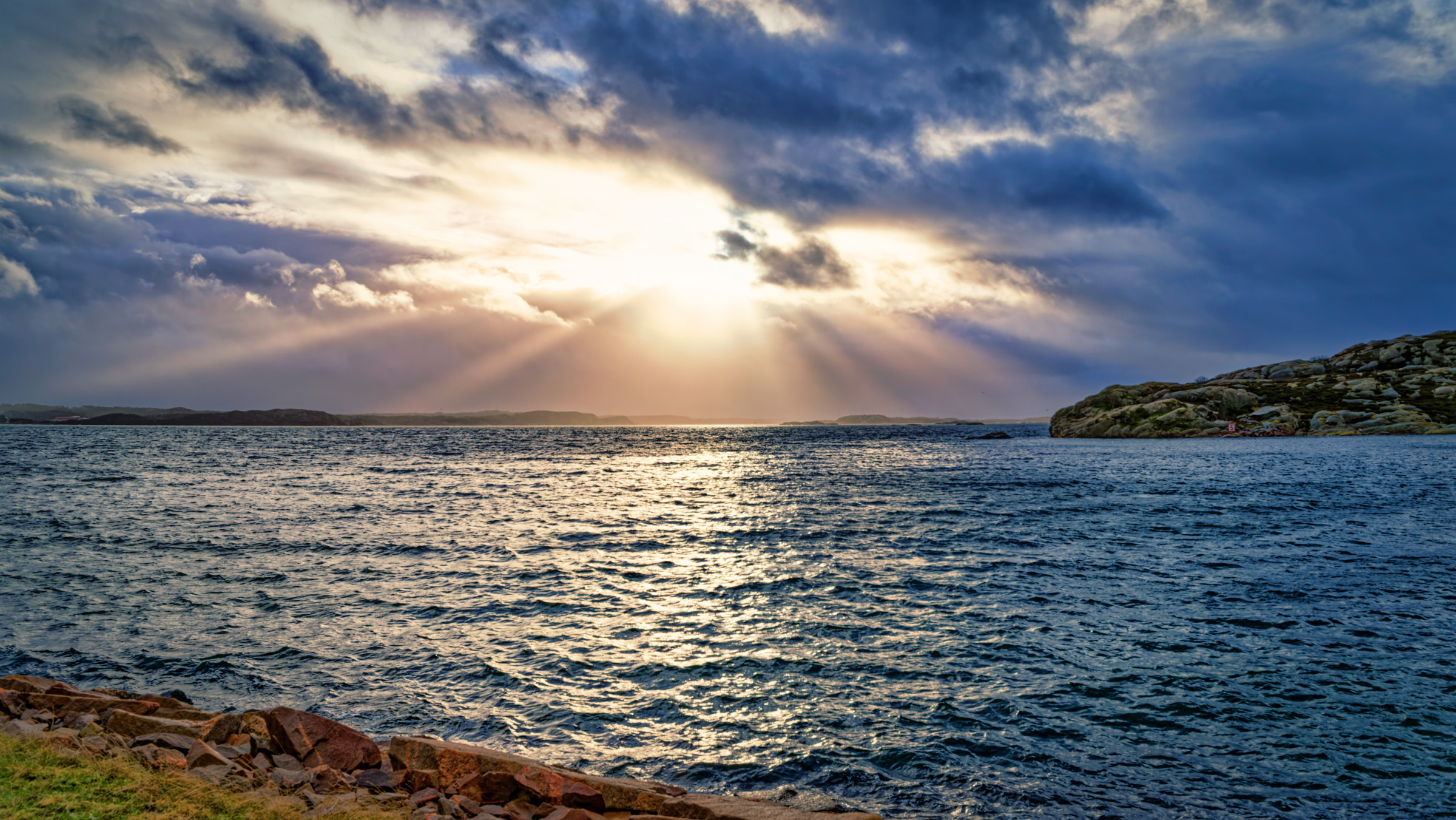 A burst of sunshine and red granite cliffs